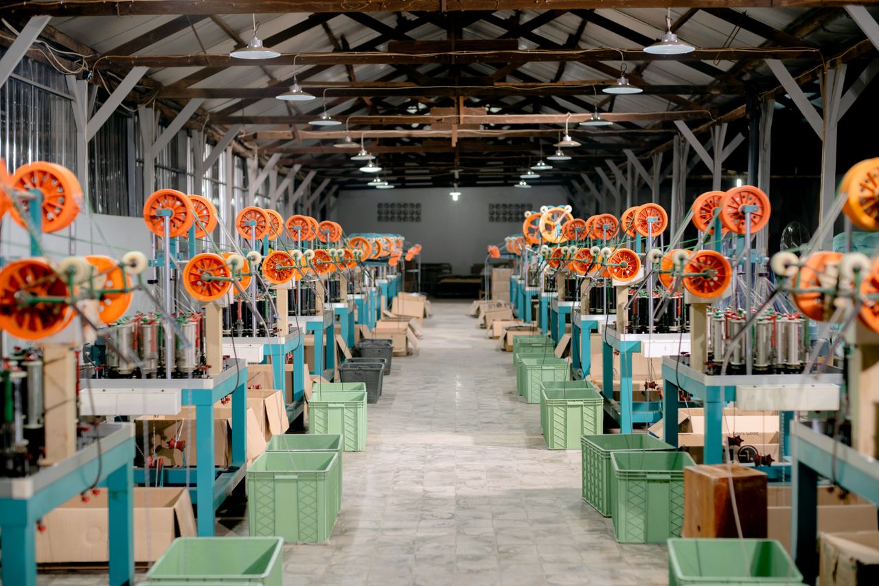 Home Spacious industrial hall with machinery and equipment for manufacturing. Ideal stock image for industry themes.