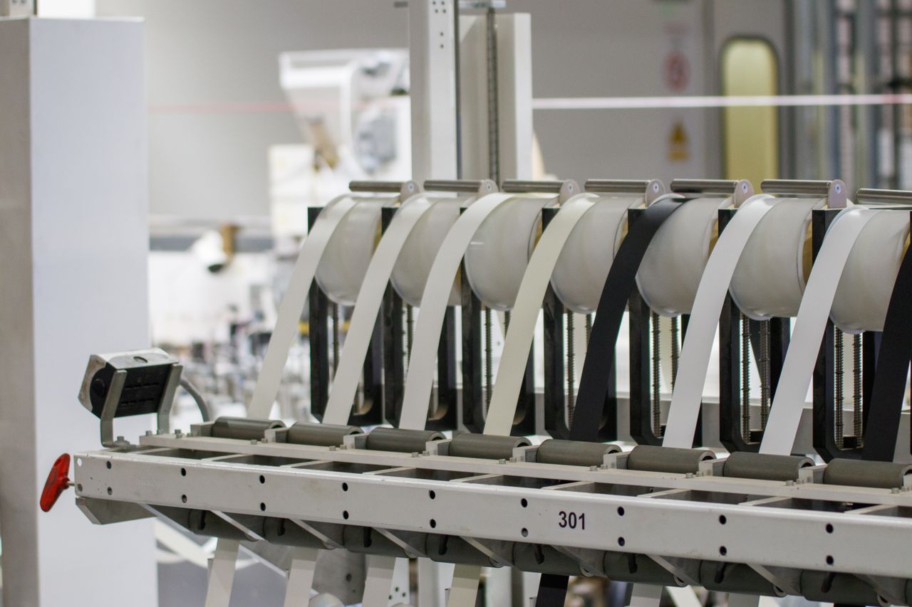 Home Modern industrial machine in operation in a manufacturing facility showcasing advanced technology.